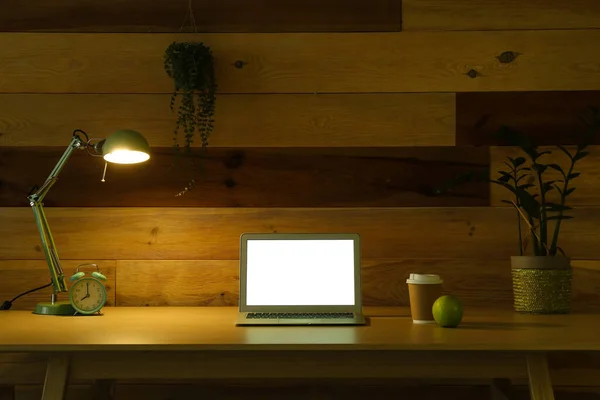 Open Laptop Glowing Lamp Cup Coffee Apple Desk Wooden Wall — Stock Photo, Image