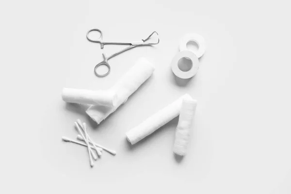 Surgical Tool Bandage Rolls Medical Plaster Cotton Buds Light Background — Stock Photo, Image