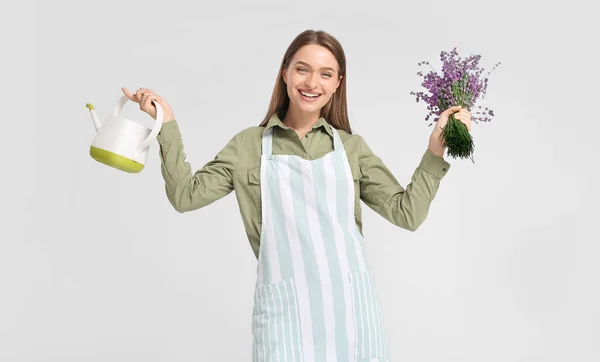 Female Gardener Lavender Watering Can Light Background — Stock Photo, Image