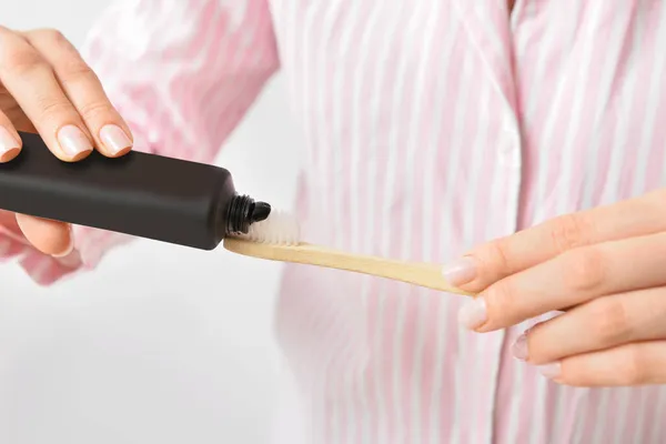 Black Toothpaste Activated Carbon Brush Female Hands Closeup — Stock Photo, Image