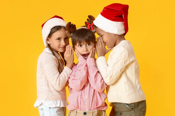 Little Children Telling Secrets Each Other Yellow Background — Stock Photo, Image