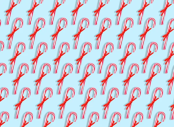 Many Candy Canes Light Blue Background Pattern Design — Stock Photo, Image