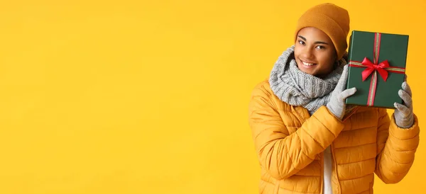 Happy African American Guy Holding Gift Box Yellow Background Space — Stock Photo, Image