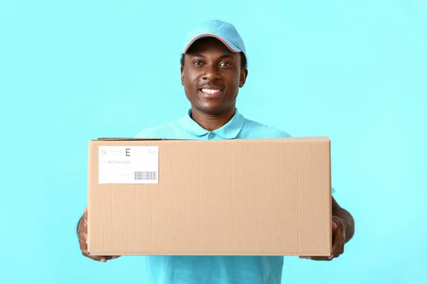 African American Delivery Man Parcel Color Background — Stock Photo, Image