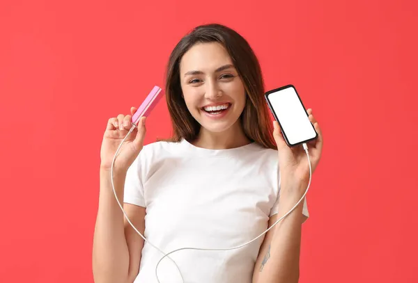 Young Woman Phone Power Bank Color Background — Stock Photo, Image