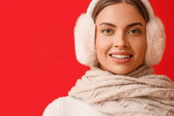 Beautiful Young Woman Warm Earmuffs Red Background — Stock Photo, Image