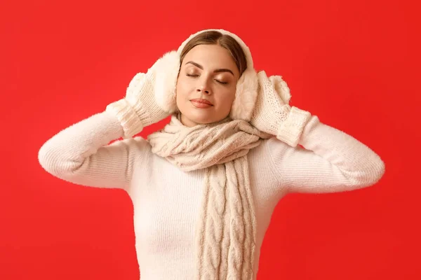 Beautiful Young Woman Warm Earmuffs Red Background — Stock Photo, Image
