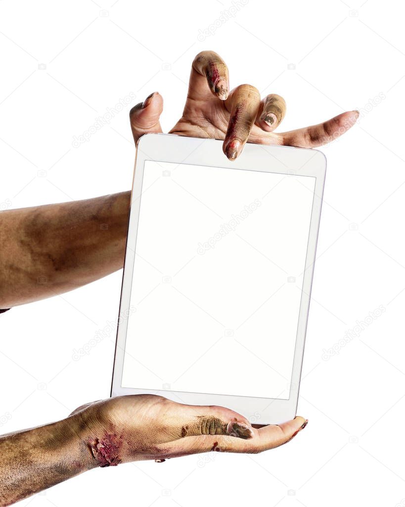 Hands of zombie with tablet computer on white background