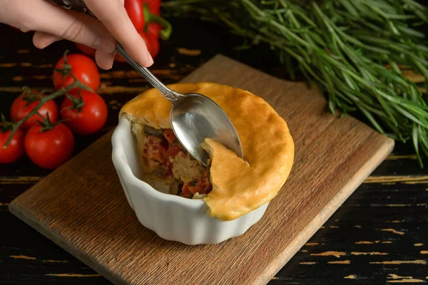 Woman Eating Tasty Vegetable Pot Pie Black Wooden Background — Stock Photo, Image