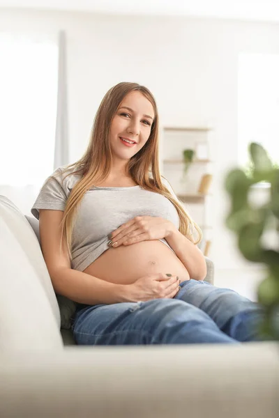 Young Pregnant Woman Sitting Grey Sofa Home — Stock Photo, Image