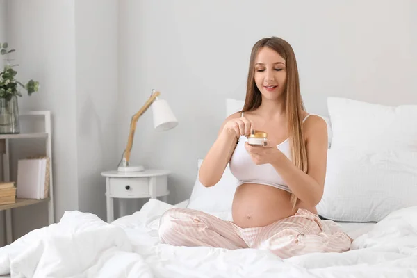 Young Pregnant Woman Jar Cream Bedroom — Stock Photo, Image