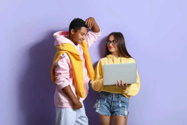 Stylish Young Couple Hoodies Using Laptop Violet Background — Stock Photo, Image