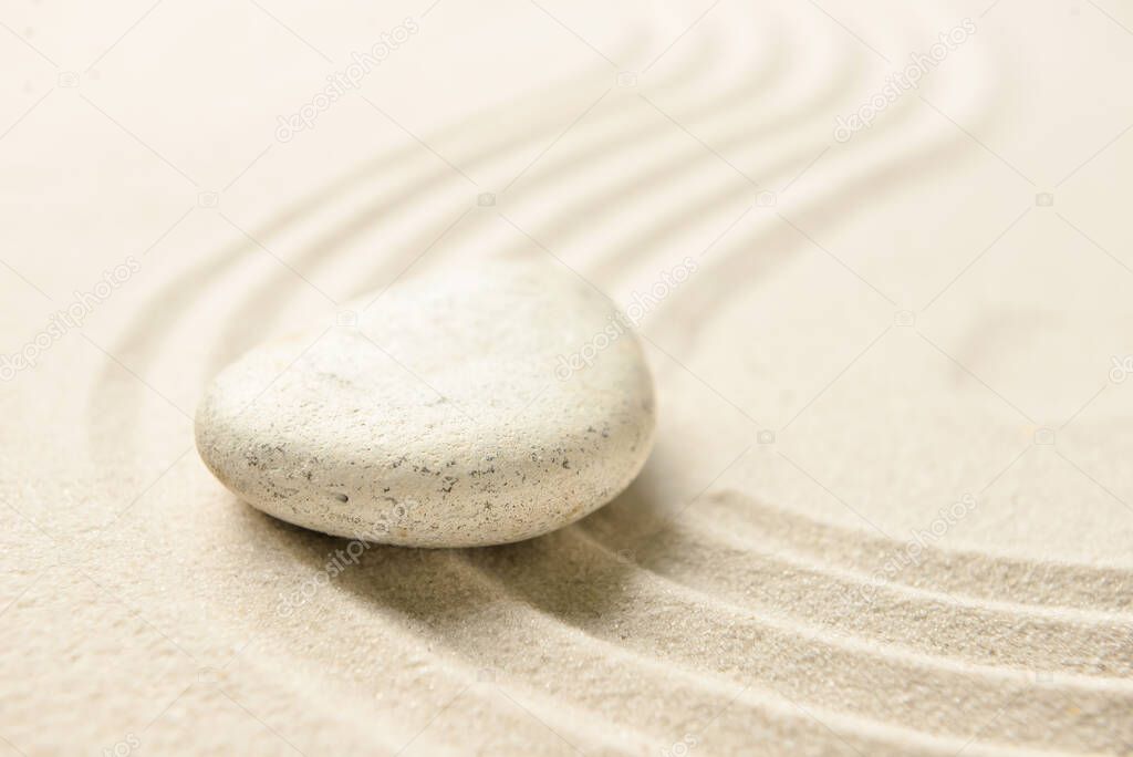 Spa stone on light sand