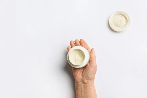 Hand Elderly Woman Jar Cosmetic Cream Light Background — Stock Photo, Image