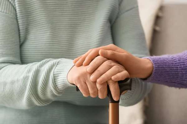 Young Woman Holding Hands Grandmother Home — Stock Photo, Image