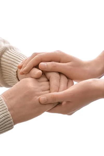 Wanita Muda Memegang Tangan Nenek Latar Belakang Putih — Stok Foto
