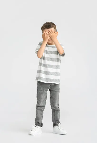Portrait Cute Little Boy Covering Eyes His Hands Light Background — Stock Photo, Image