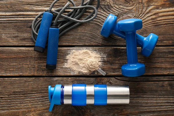 Protein Powder Bottle Skipping Rope Dumbbells Wooden Background — Stock Photo, Image