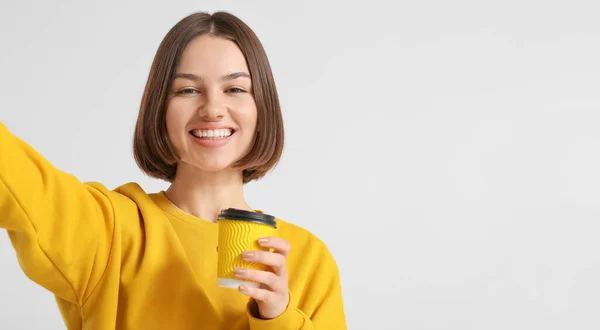 Beautiful Woman Cup Coffee Taking Selfie Light Background — Stock Photo, Image