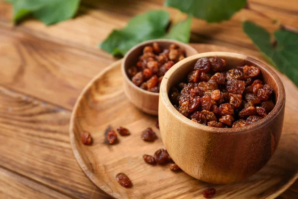 Bowls Tasty Raisins Wooden Background Closeup — Stock Photo, Image