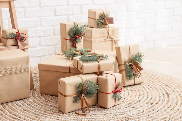 Christmas Gift Boxes Fir Branches White Brick Wall — Stock Photo, Image