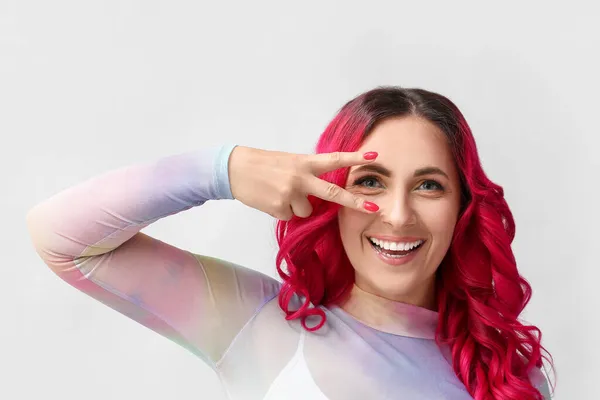 Beautiful Woman Unusual Bright Hair Color Showing Victory Gesture Light — Stock Photo, Image