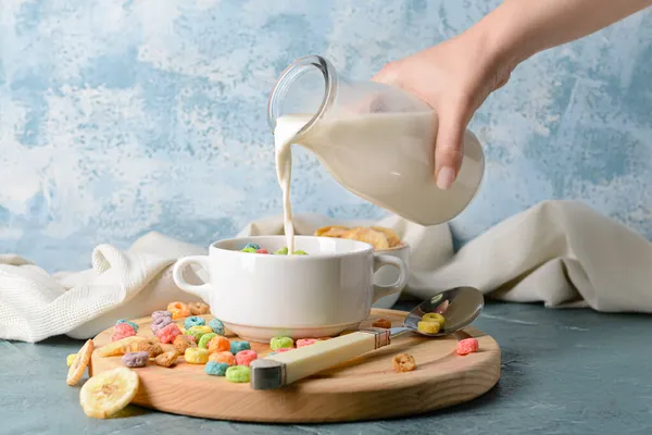 Woman Adding Milk Crunchy Corn Flakes Rings Pot — Stock Photo, Image