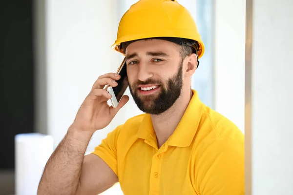 Construction Worker Talking Mobile Phone Window Room — Stock Photo, Image