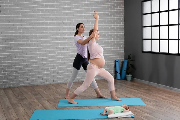 Young Pregnant Woman Doing Yoga Little Baby Trainer Gym — Stock Photo, Image