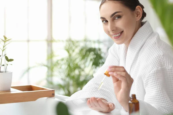 Beautiful Smiling Woman Applying Essential Oil Hands Bathroom — Stock Photo, Image