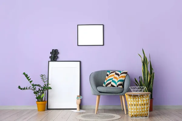 Blank Frames Grey Armchair Lilac Wall — Stock Photo, Image
