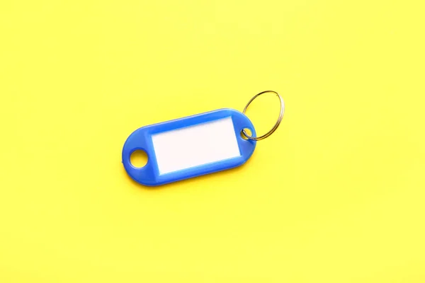 Plastic Key Tag Yellow Background — Stock Photo, Image