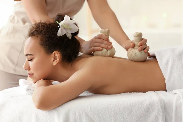 Young African American Woman Getting Massage Therapist Herbal Bags Spa — Stock Photo, Image