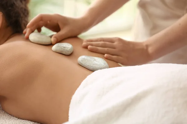 Young African American Woman Getting Massage Therapist Spa Stones Salon — Stock Photo, Image