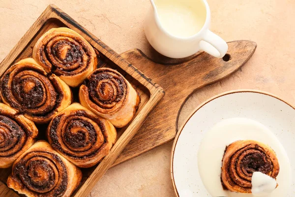 Wooden Board Tasty Cinnamon Rolls Beige Background Closeup — Stock Photo, Image