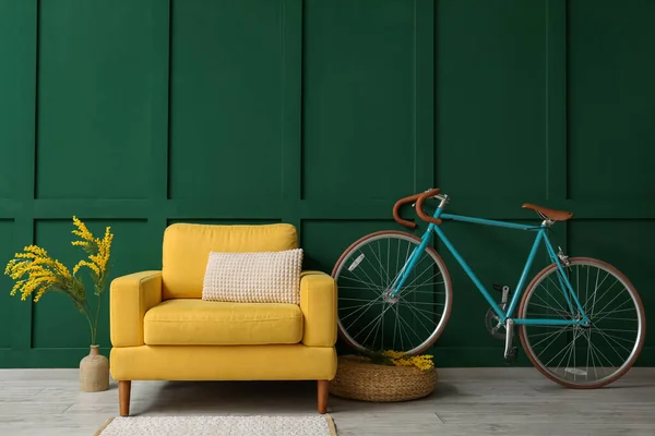 Yellow Armchair Bicycle Flowers Green Wall — Stock Photo, Image