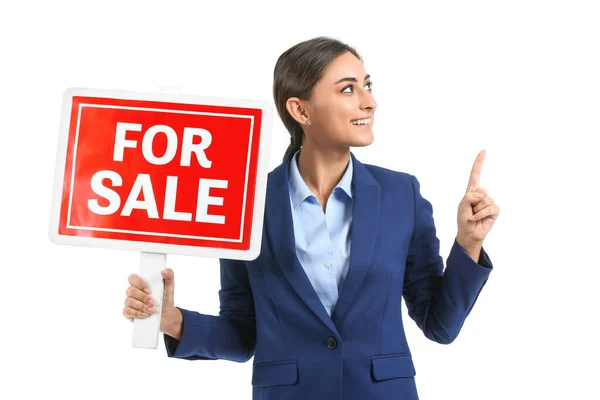 Female Real Estate Agent Sale Board Showing Something White Background — Stock Photo, Image