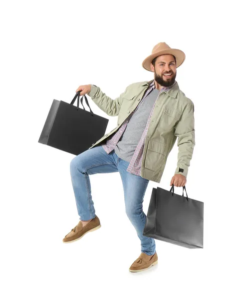 Siyah Cuma Alışveriş Çantalı Yakışıklı Adam Beyaz Arka Planda Zıplıyor — Stok fotoğraf