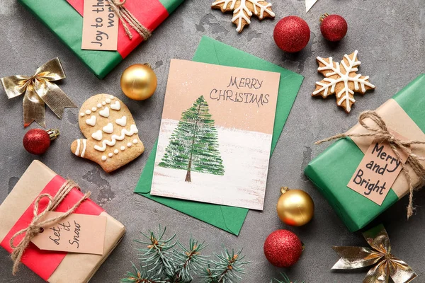 テキストとグリーティングカードメリークリスマス ギフトやグランジの背景にクッキー — ストック写真