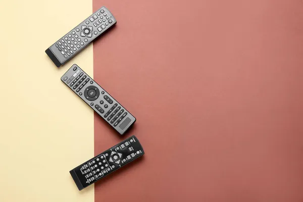 Different Modern Remote Controllers Color Background — Stock Photo, Image