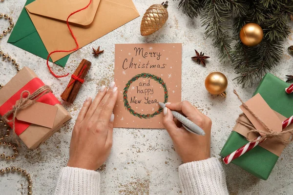 Woman Signing Card Text Merry Christmas Happy New Year Light — Stock Photo, Image
