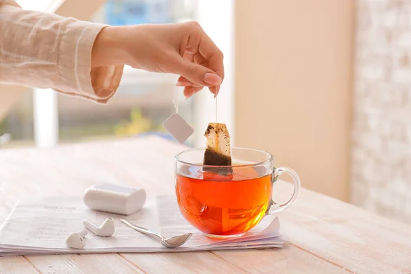Female Hand Dipping Tea Bag Hot Water Table Cafe — Stock Photo, Image