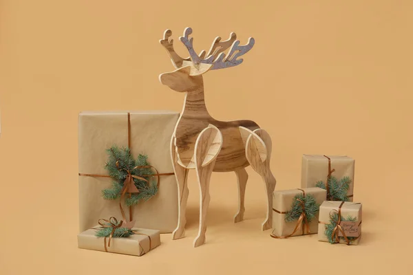 Wooden Reindeer Christmas Presents Beige Background — Stock Photo, Image