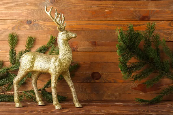 Golden Reindeer Fir Branches Wooden Background — Stock Photo, Image