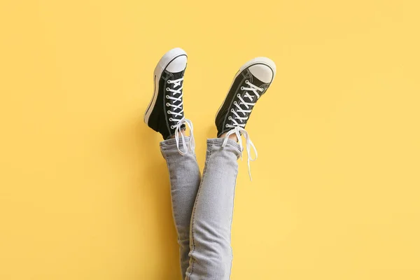 Legs Woman Black Sneakers White Laces Yellow Background — Stock Photo, Image