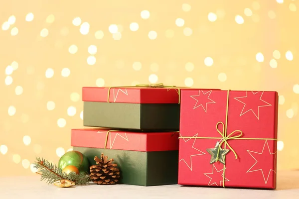 Christmas Gift Boxes Table Blurred Lights — Stock Photo, Image