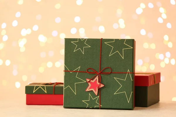 Christmas Gift Boxes Table Blurred Lights — Stock Photo, Image