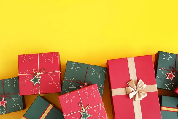 Different Christmas Gift Boxes Yellow Background — Stock Photo, Image