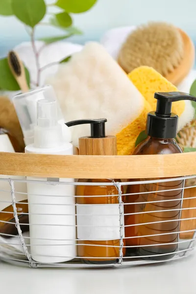 Basket Bottles Cosmetic Products Bath Sponges Table Closeup — Stock Photo, Image