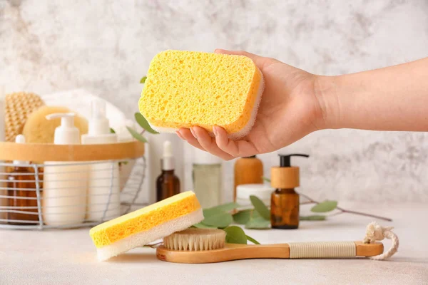 Female Hand Sponge Massage Brush Bath Supplies Table Light Background — Stock Photo, Image